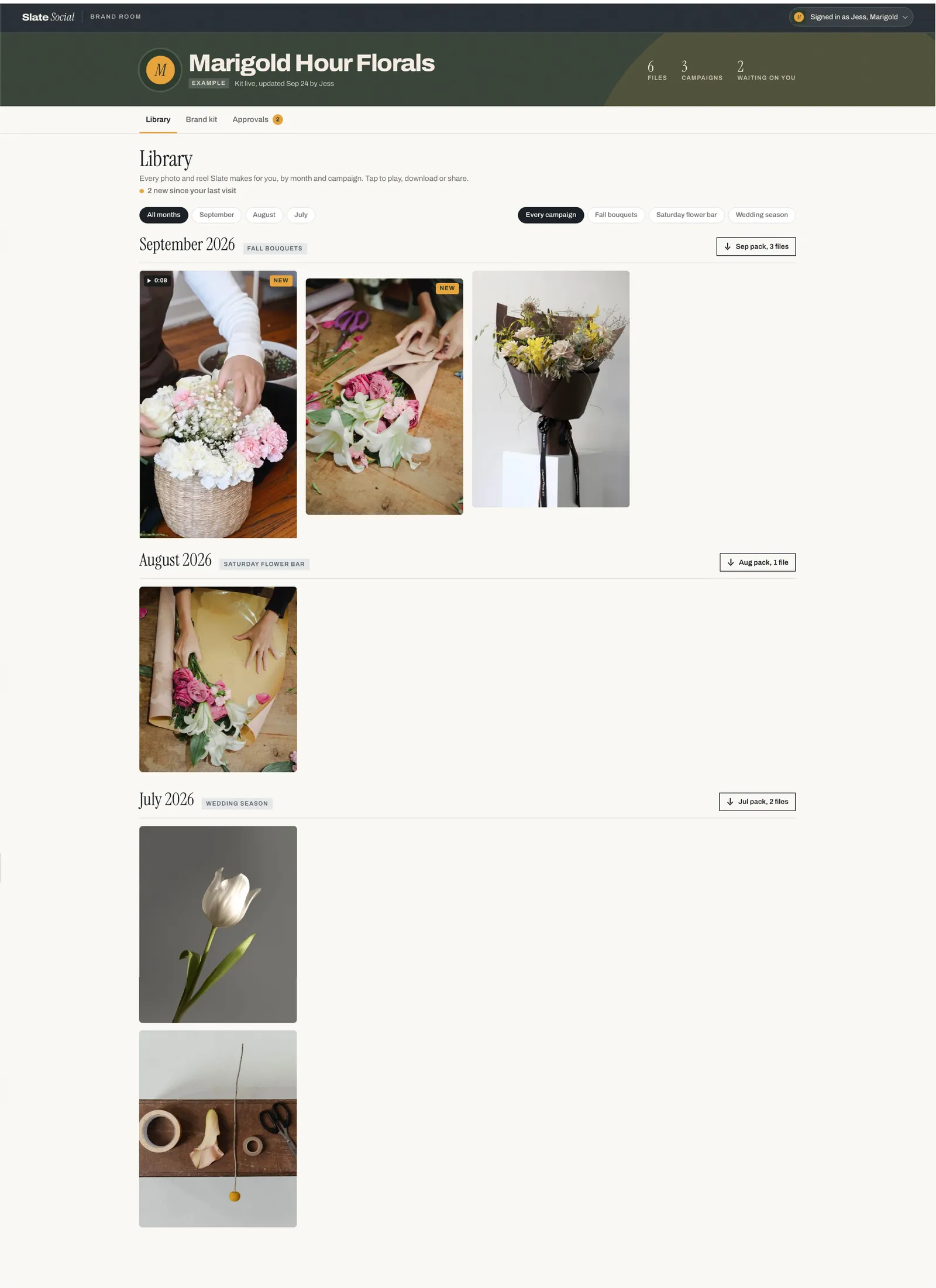 Slate Social Brand Room for a client named Marigold Hour Florals, with a library of photos and a reel grouped by month and campaign, download packs, and tabs for Library, Brand kit and Approvals